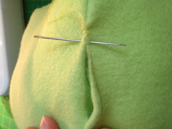 hand sew shut all the openings in each square that you stuffed into